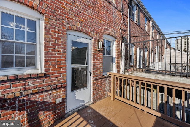 property entrance with a wooden deck