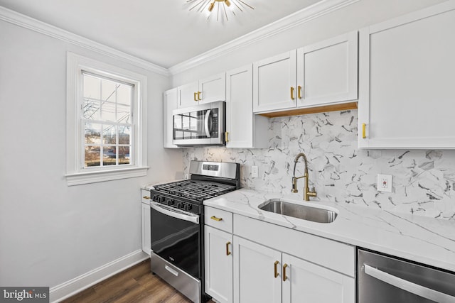 kitchen with white cabinetry, sink, backsplash, and stainless steel appliances