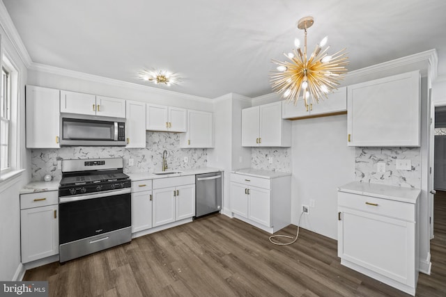 kitchen featuring stainless steel appliances, sink, and white cabinets