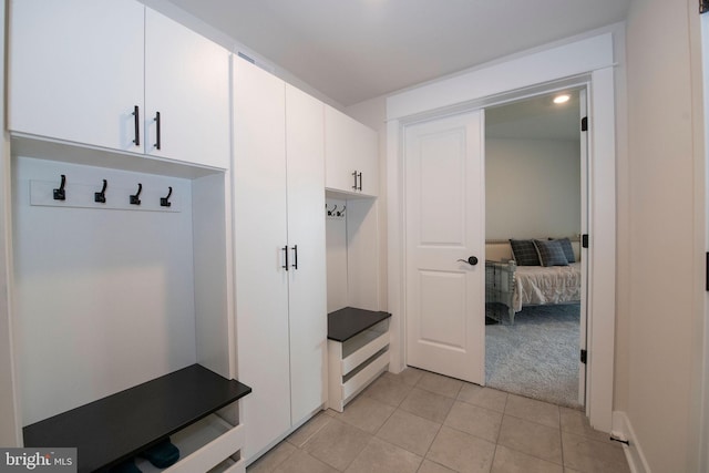 mudroom with light tile patterned flooring