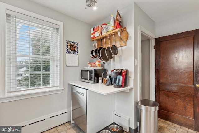 kitchen featuring a baseboard radiator and appliances with stainless steel finishes