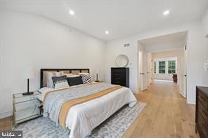 bedroom with light hardwood / wood-style flooring