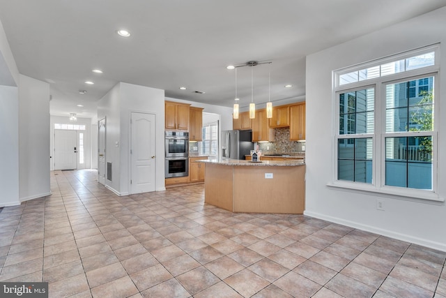 kitchen with light tile patterned floors, decorative backsplash, a peninsula, stainless steel appliances, and recessed lighting