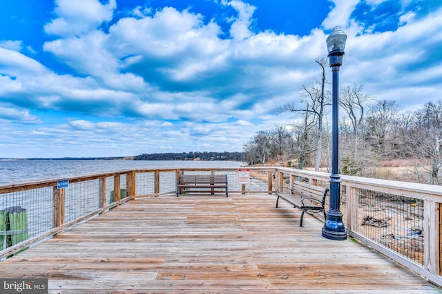 dock area with a deck with water view