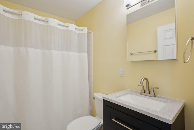 full bathroom with vanity, a shower with curtain, and toilet