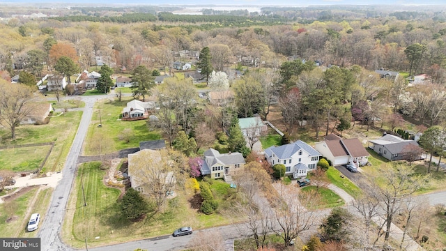 bird's eye view featuring a view of trees and a residential view
