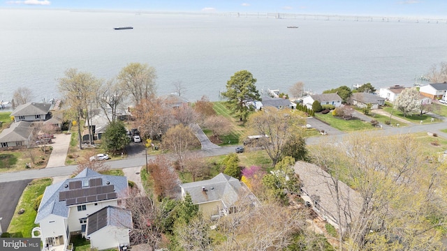 birds eye view of property with a water view and a residential view