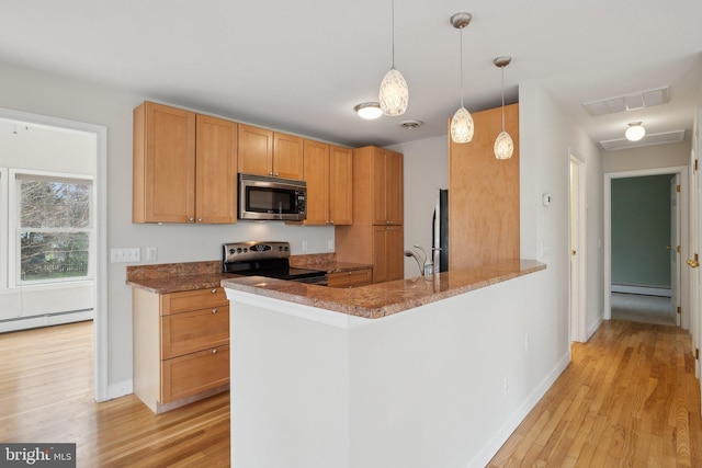 kitchen with stainless steel appliances, baseboard heating, and light wood-style floors