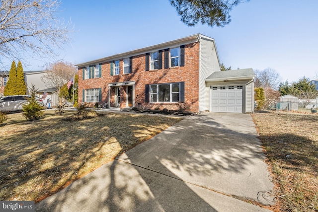 view of front of home featuring a garage and a front yard