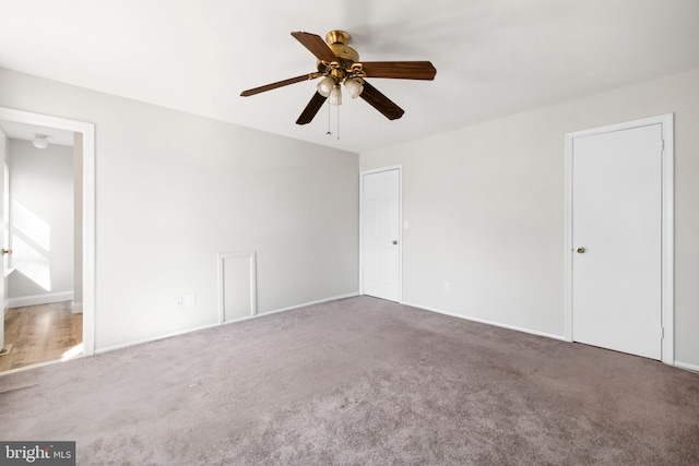 unfurnished bedroom featuring ceiling fan, connected bathroom, and carpet