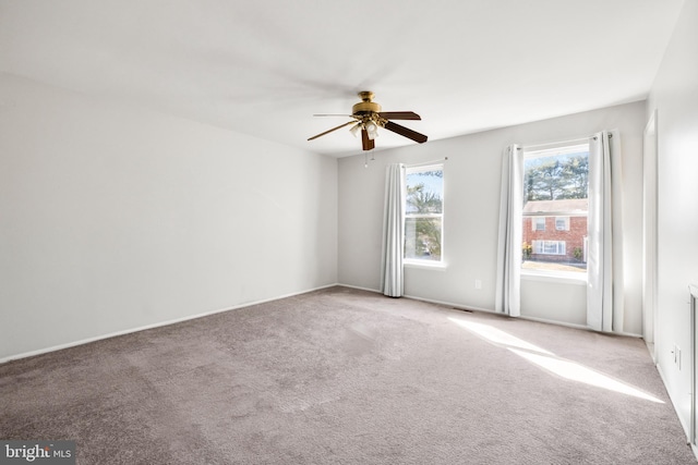 unfurnished room with carpet floors and ceiling fan