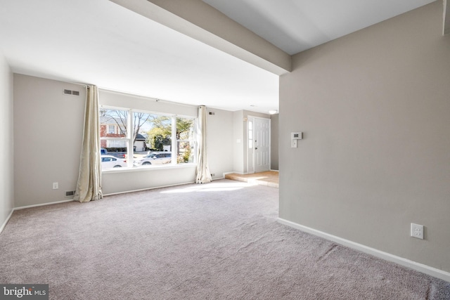 spare room featuring carpet flooring