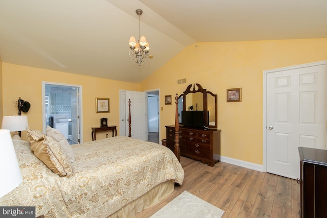 bedroom with hardwood / wood-style flooring, lofted ceiling, and a chandelier