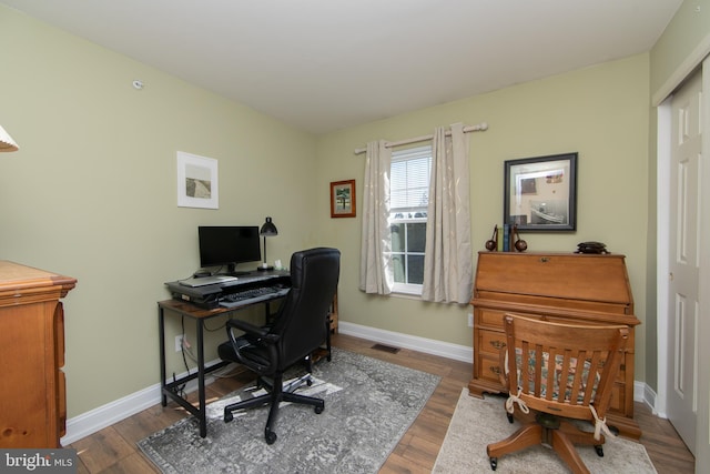 office space with hardwood / wood-style floors