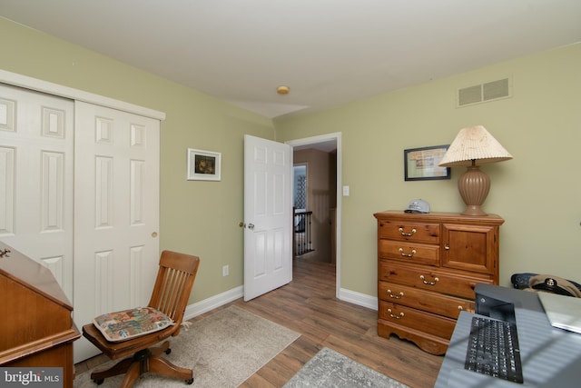 office with wood-type flooring