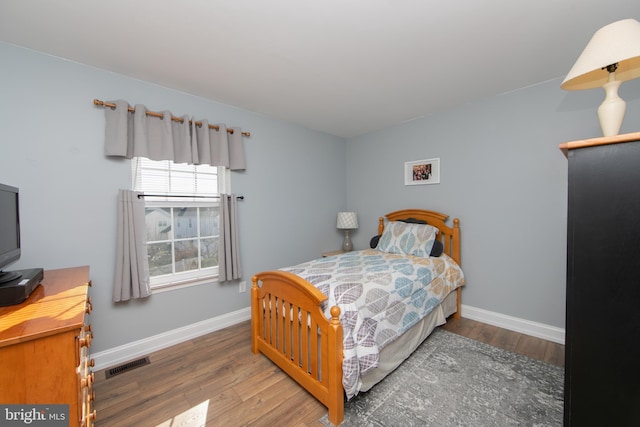 bedroom featuring hardwood / wood-style flooring