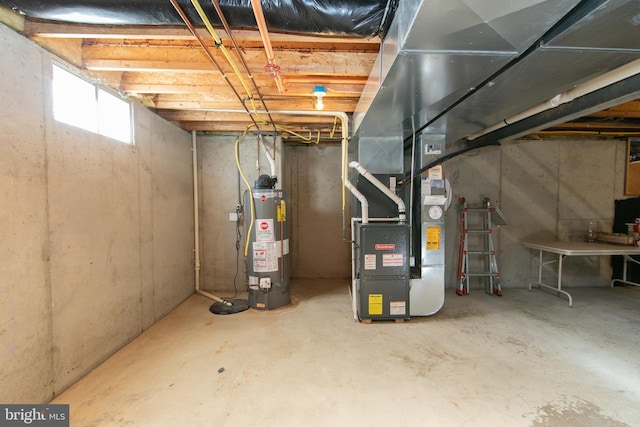 basement featuring heating unit and gas water heater