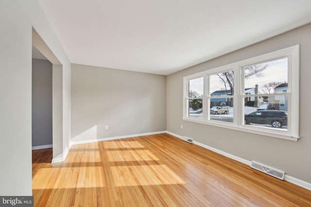 spare room with hardwood / wood-style flooring