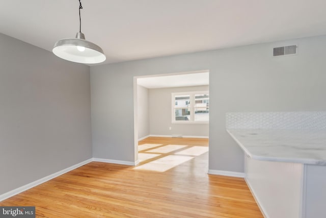 dining room featuring light hardwood / wood-style floors