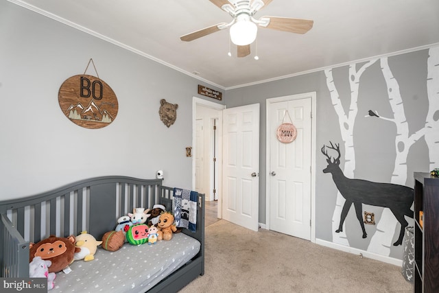 bedroom featuring ceiling fan, ornamental molding, and light carpet