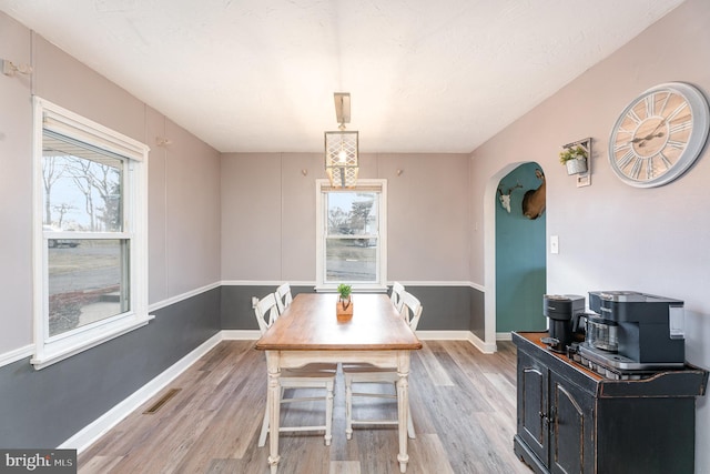 dining room featuring wood-type flooring