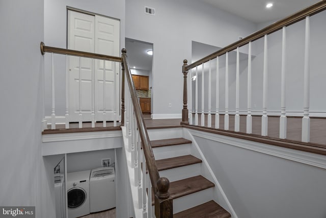 staircase featuring washer / clothes dryer