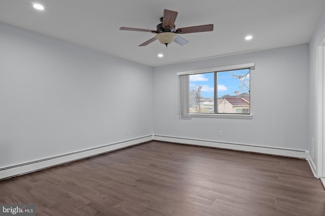 unfurnished room featuring a baseboard heating unit, hardwood / wood-style flooring, and ceiling fan