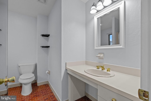 bathroom with sink and toilet