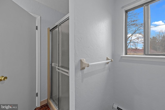 bathroom with a shower with shower door