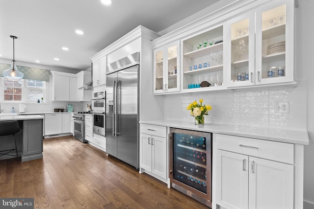 kitchen featuring wine cooler, dark wood-style flooring, high quality appliances, white cabinetry, and glass insert cabinets