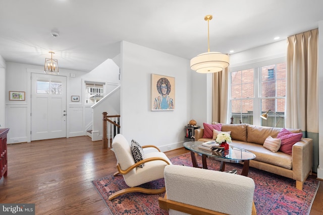 living area with plenty of natural light, stairs, wood finished floors, and recessed lighting