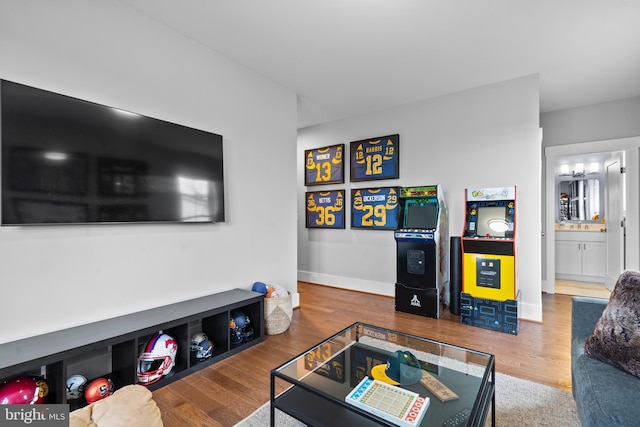 living area with wood finished floors and baseboards