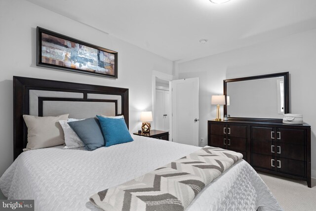 bedroom with light colored carpet