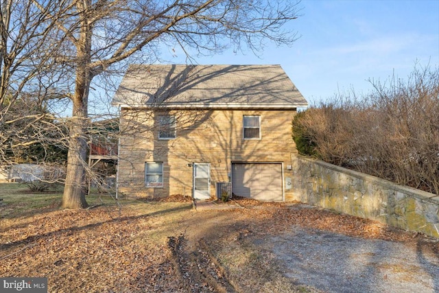 view of side of home with a garage