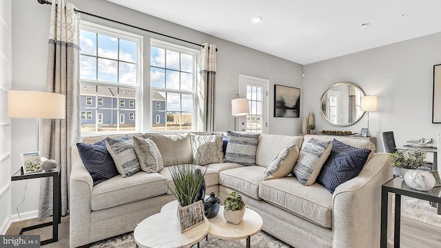 living area featuring wood finished floors and baseboards