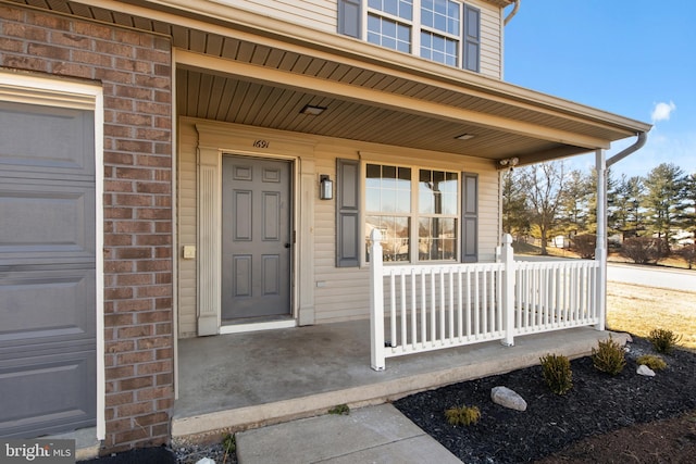 entrance to property with covered porch