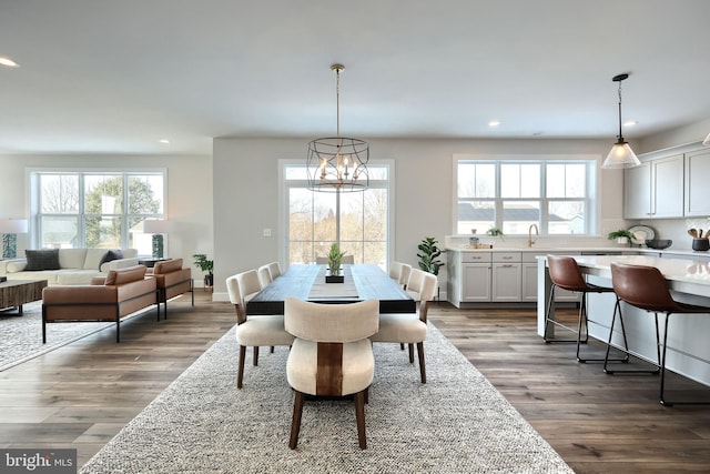 dining space with dark wood-style floors, recessed lighting, and plenty of natural light