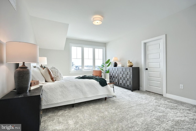 bedroom with carpet floors and baseboards