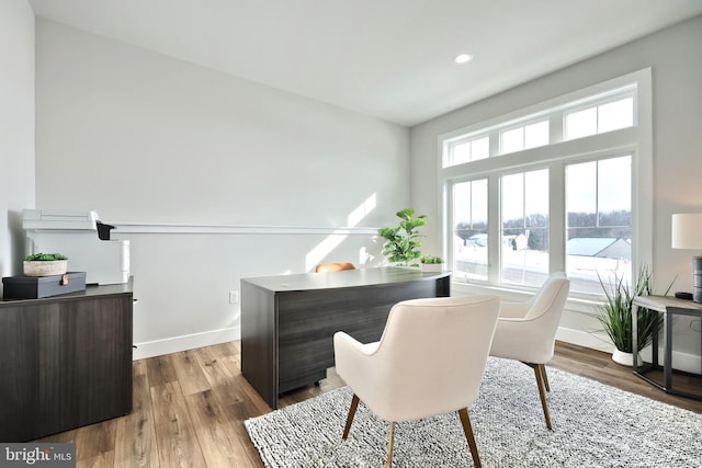 office space with baseboards, wood finished floors, and recessed lighting