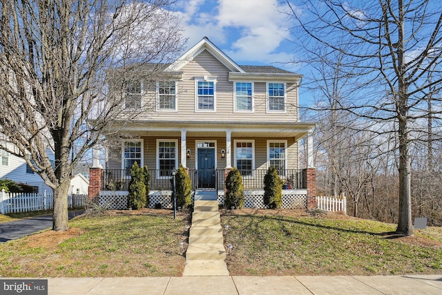 view of front of home featuring a porch and a front yard