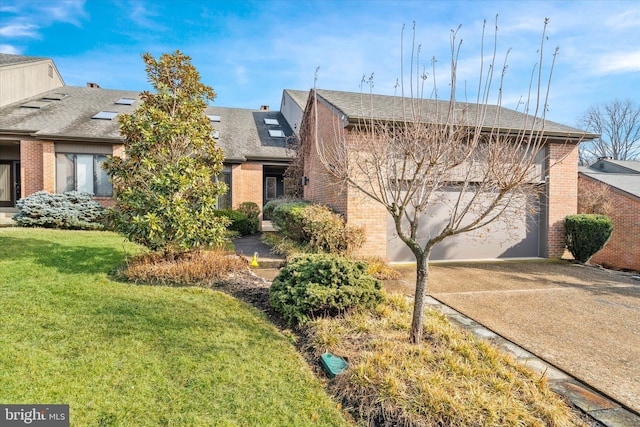 view of front of property with a front lawn and a garage