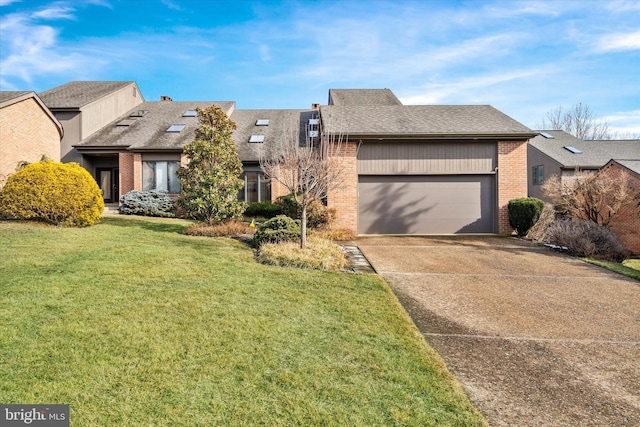 view of front facade with a garage and a front lawn