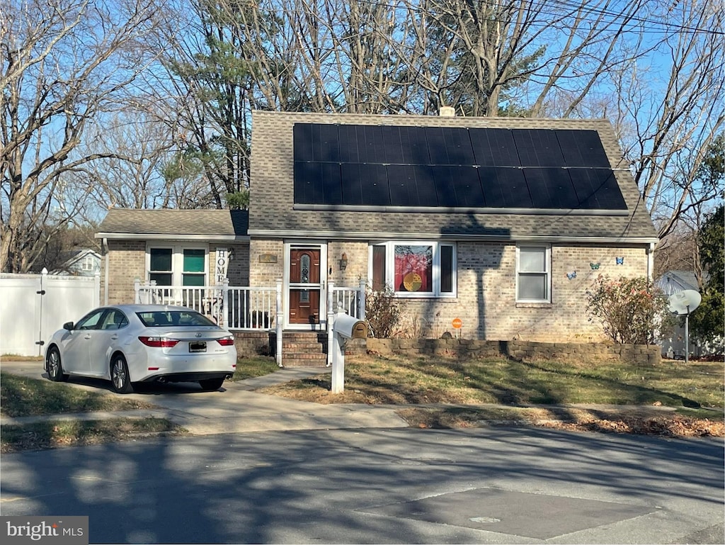 view of front of house featuring solar panels