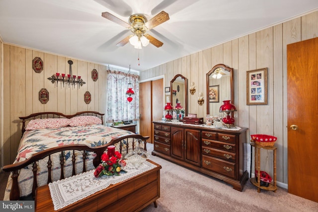 bedroom featuring ceiling fan and light colored carpet