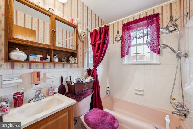 bathroom featuring wallpapered walls, shower / bath combo with shower curtain, backsplash, and vanity