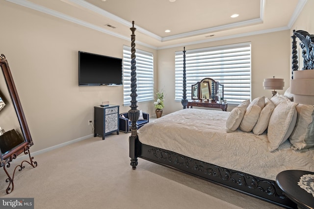 bedroom with light carpet, crown molding, and a raised ceiling