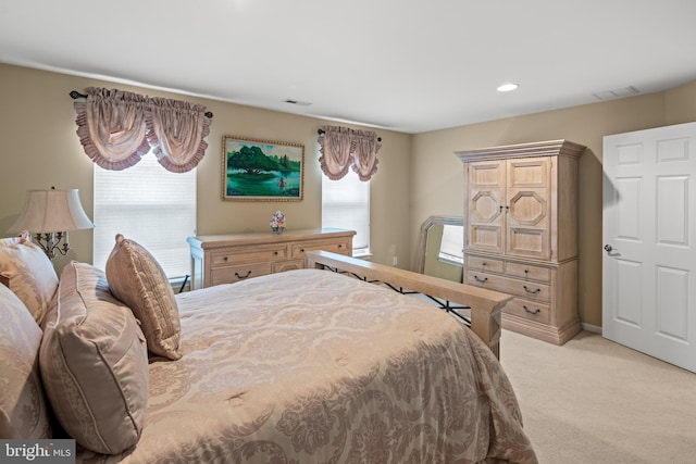 bedroom with light colored carpet