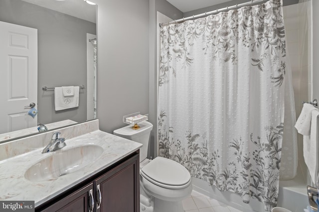 full bathroom featuring toilet, tile patterned floors, shower / tub combo with curtain, and vanity