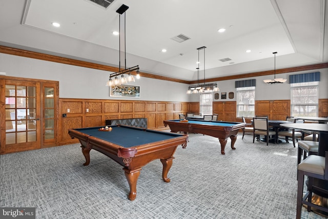 game room with a tray ceiling, pool table, carpet floors, and ornamental molding