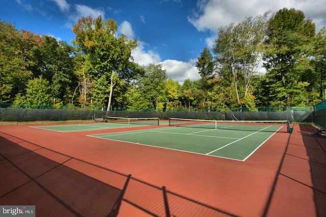 view of sport court with basketball hoop